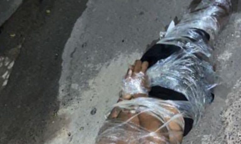 BRUTAL! Bandidos abandonam corpo adesivado em praça do Arraial do Retiro